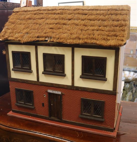 A dolls house with contents W.67cm